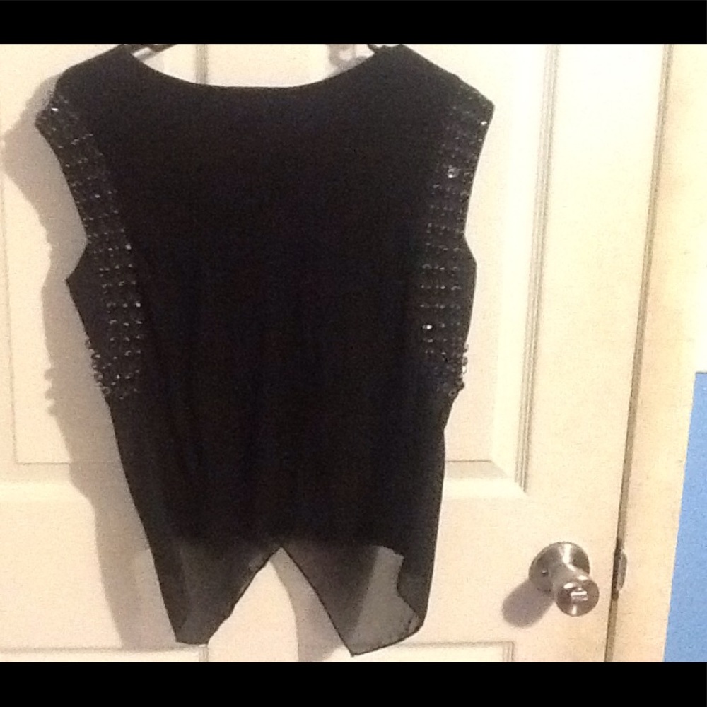 Brand new black top with black jewels on the arms